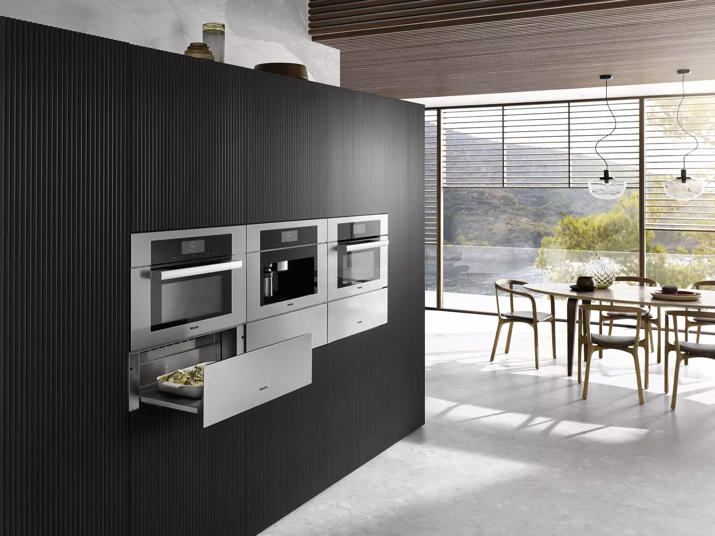 Miele built-in ovens and coffee machine integrated into a modern luxury kitchen